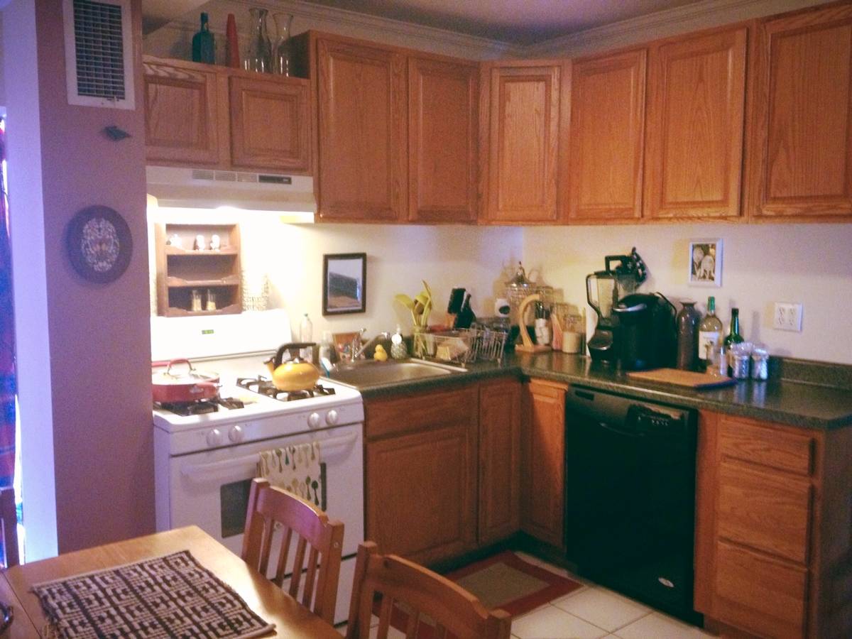 Dim kitchen photo before automatic enhancement